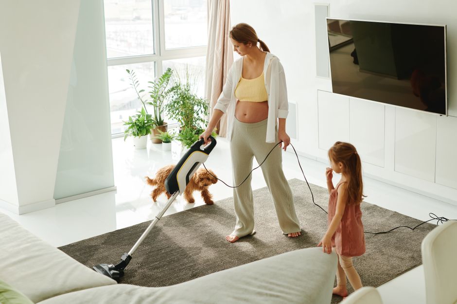 Professional vacuuming living room carpet